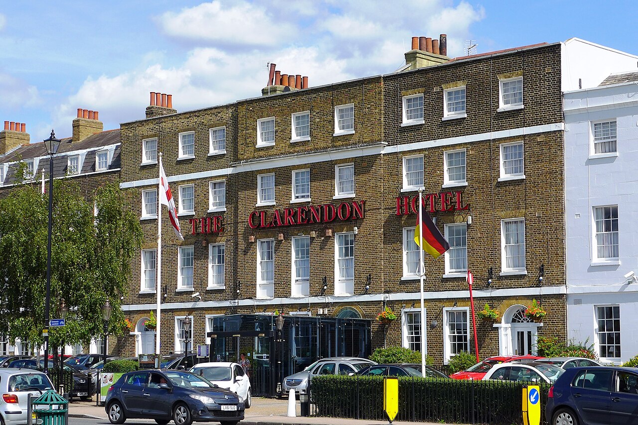 The Clarendon Hotel, Blackheath: a long yellow-brick Georgian terrace of three storeys with the hotel's name in red letters across the front